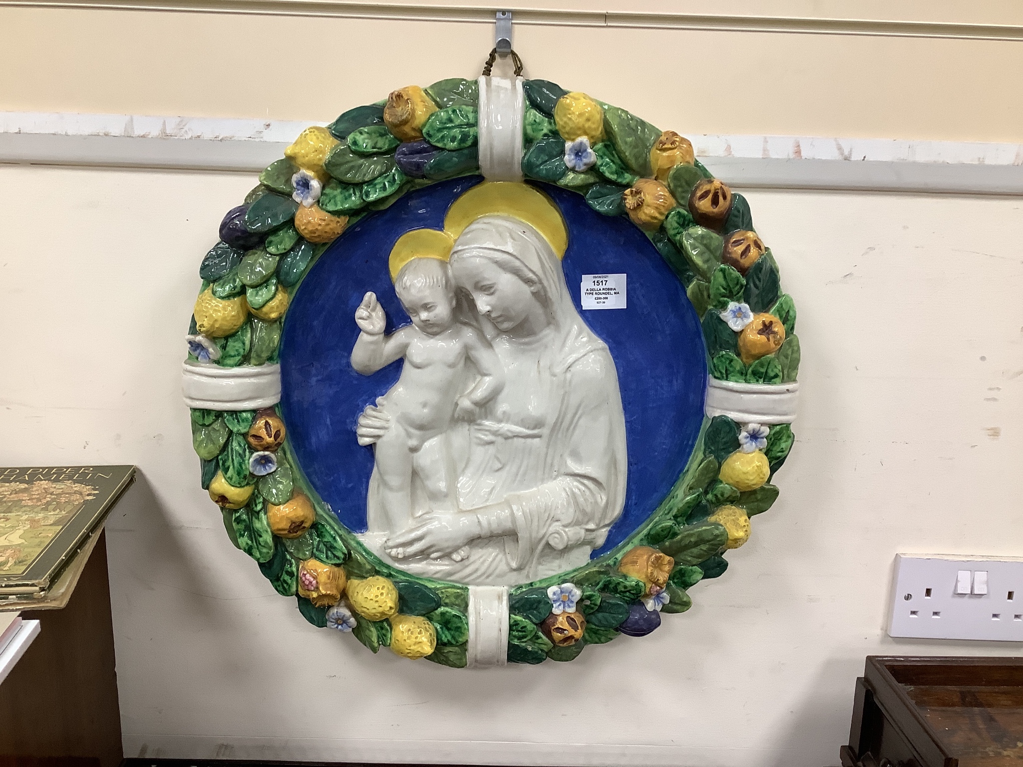 A Della Robbia type roundel, Madonna and Child